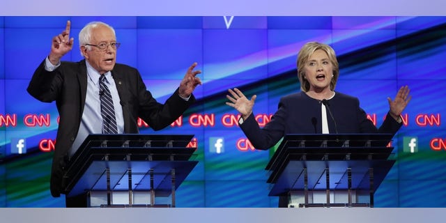 Democratic presidential candidates Sen. Bernie Sanders and former Secretary of State Hillary Clinton debate during the first official Democratic candidates debate of the 2016 presidential campaign in Las Vegas, Oct. 13, 2015. (REUTERS/Lucy Nicholson)