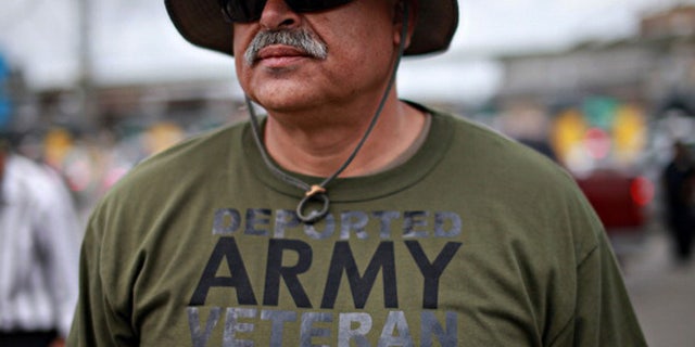 TIJUANA, MEXICO - MARCH 27: U.S. Army veteran Hector Lopez participates in a protest by deported military personel at the U.S.- Mexico border March 27, 2014 in Tijuana, Mexico. Several veterans organizations, including Veterans Without Borders, Banished Veterans and Coalicion Humanitaria Promigrante (CHIP) gathered for the demonstration to promote a petition to Congress and the Obama Administration, which requires 100,000 signatures in 30 days to gain an audience, demanding that deported military veterans be brought back to the United States. (Photo by Sandy Huffaker/Getty Images)