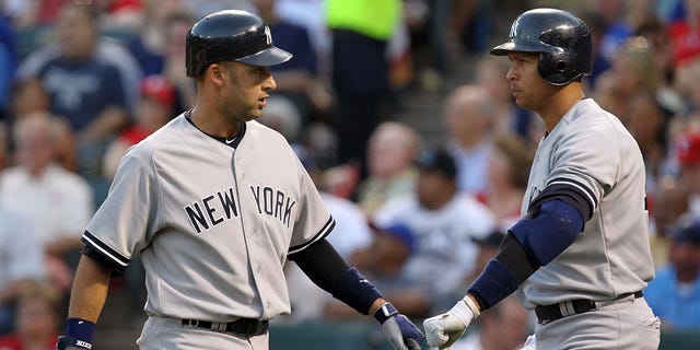 Jeter and Rodriguez in Arlington on May 7, 2011 in Arlington, Texas.