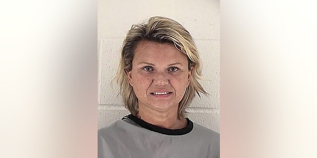 This booking photo released by the Johnson County (Kan.) Sheriff's Office shows Kelli Jo Bauer. Authorities say that Bauer, arrested earlier this month, stole more than $100,000 worth of women’s clothing and merchandise, which she was selling out of her nearly $1 million home in the upscale Kansas City suburb of Overland Park, Kan. (Johnson County (Kan.) Sheriff's Office via AP)