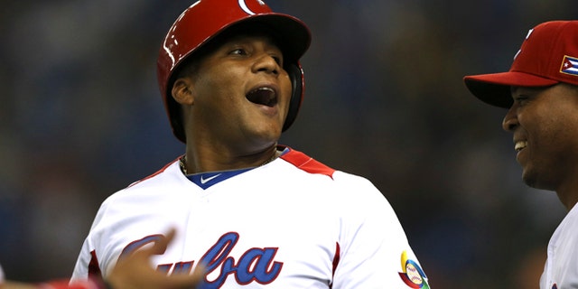 Archive photo from March 9, 2013, of outfielder Alfredo Despaigne after hitting a home run against Taiwan for the Cuban national baseball team at the World Baseball Classic. (AP/Toru Takahashi)