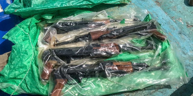 The cache of small arms included hundreds of AK-47s.