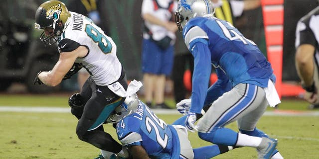 Aug 28, 2015; Jacksonville, FL, USA; Detroit Lions cornerback Nevin Lawson (24) cannot stop Jacksonville Jaguars wide receiver Bryan Walters (81) from scoring a touchdown during the second half of an NFL preseason football game at EverBank Field. The Lions won 22-17. Mandatory Credit: Reinhold Matay-USA TODAY Sports