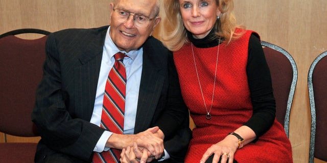 Feb. 24, 2014: U.S. Rep. John Dingell, left, and his wife Debbie hold hands during a legislative forum at the Southern Wayne County Regional Chamber (SWCRC) at the Crystal Gardens in Southgate, Mich.