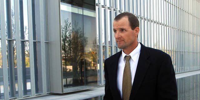 Jared Ehlers, of Moab, walks from the Federal Courthouse after appearing in court Wednesday, April 30, 2014, in Salt Lake City. Ehlers has has pleaded not guilty to federal charges of stealing a fossilized dinosaur footprint. He is accused of dislodging a piece of sandstone with a three-toed ancient dinosaur track from the Hell's Revenge jeep Trail in the Sand Flats Recreation Area near Moab. Ehlers is charged under a federal law passed in 2009 to protect paleontological artifacts. (AP Photo/Rick Bowmer)