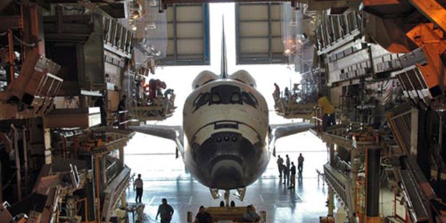 The space shuttle Discovery is shown inside its Orbital Processing Facility, a maintenance hangar used to service the spacecraft in between spaceflights, in this 2005 photo.