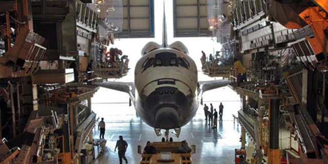 The space shuttle Discovery is shown inside its Orbital Processing Facility, a maintenance hangar used to service the spacecraft in between spaceflights, in this 2005 photo.