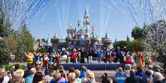 ANAHEIM, CA - JULY 17:  In this handout photo provided by Disney parks, Mickey Mouse and his friends celebrate the 60th anniversary of Disneyland park during a ceremony at Sleeping Beauty Castle featuring Academy Award-winning composer, Richard Sherman and Broadway actress and singer Ashley Brown July 17, 2015 in Anaheim, California.  Celebrating six decades of magic, the Disneyland Resort Diamond Celebration features three new nighttime spectaculars that immerse guests in the worlds of Disney stories like never before with "Paint the Night," the first all-LED parade at the resort; "Disneyland Forever," a reinvention of classic fireworks that adds projections to pyrotechnics to transform the park experience; and a moving new version of "World of Color" that celebrates Walt Disneys dream for Disneyland.  (Photo by Paul Hiffmeyer/Disneyland Resort via Getty Images)