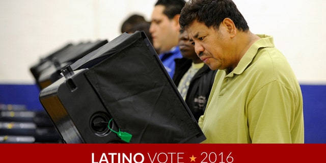 LAS VEGAS, NV - NOVEMBER 06: Antonio Escober casts his ballot at the polling station at John Fremont Middle School on November 6, 2012 in Las Vegas, Nevada. Voting is underway in the battleground state of Nevada as President Barack Obama and Republican nominee former Massachusetts Gov. Mitt Romney remain in a virtual tie in the national polls. (Photo by David Becker/Getty Images)