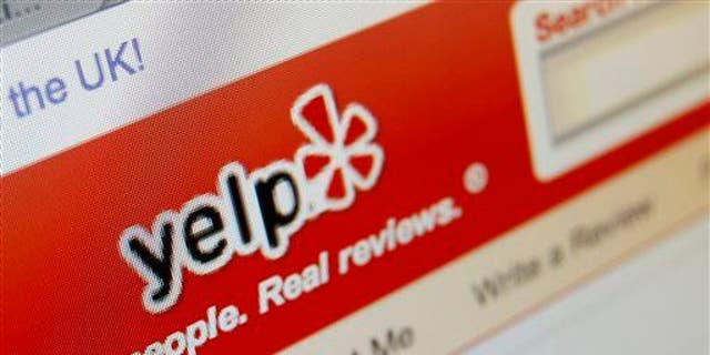 This March 17, 2010, file photo shows the Yelp website on a computer screen in Los Angeles.