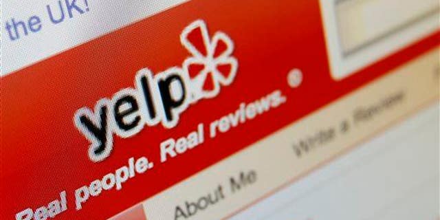 This March 17, 2010, file photo shows the Yelp website on a computer screen in Los Angeles.