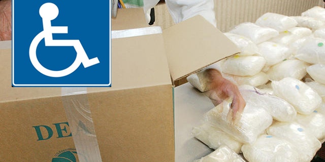A U.S. Drug Enforcement Administration agent shows some of the 187 plus pounds of methamphetamine that was seized along with some 41 kilos of cocaine at a house in Gwinnett County on Aug. 16 during a DEA news conference in Atlanta, Monday, Aug. 21, 2006. Four defendants were also arrested and agents recovered a money counter, digital scales, and a large sum of suspected drug proceeds. (AP Photo/Ric Feld)