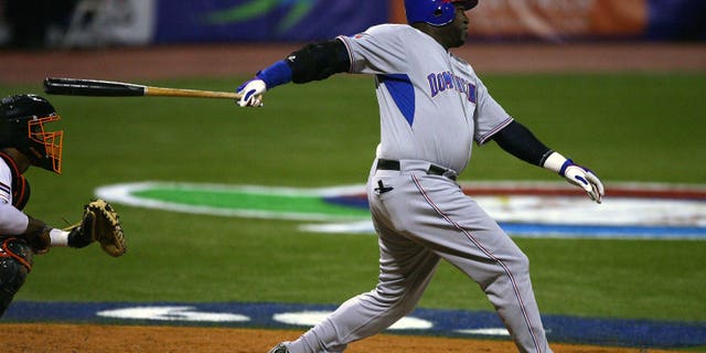 SAN JUAN, PUERTO RICO - MARCH 10: David Ortiz #34 of the Dominican Republic hits a double against the Netherlands during the 2009 World Baseball Classic Pool D match at Hiram Bithorn Stadium March 10, 2009 in San Juan, Puerto Rico. (Photo by Al Bello/Getty Images)