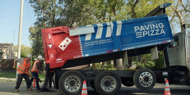 Domino's Pizza is paving streets across America as part of its "Paving for Pizza" campaign.