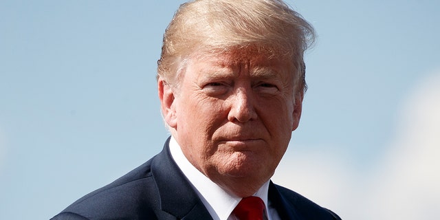 President Donald Trump boards Air Force One at Morristown Municipal Airport, in Morristown, N.J., Saturday, Aug. 4, 2018, en route to a rally in Lewis Center, Ohio. (AP Photo/Carolyn Kaster)