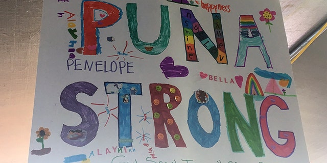 Girl Scout troop No. 26 provides artwork to help soothe frazzled nerves at a community donation center.