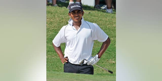 FILE - In this Aug. 20, 2009, file photo, Bhavik Patel, of Bakersfield, Calif., watches his shot from a bunker on the eighth green against Byeong-Hun An during the semifinal round of the U.S. Amateur Golf Championship in Tulsa, Okla. Patel has been suspended one year for violating the PGA Tour's anti-doping policy, making him the second player to be suspended since golf began its drug testing program in June 2008. The tour said the suspension would be retroactive to Oct. 7, 2014. That means Patel would not be eligible to play until Web.com Q-school next fall. Patel has never played a PGA Tour event. (AP Photo/Sue Ogrocki, File)