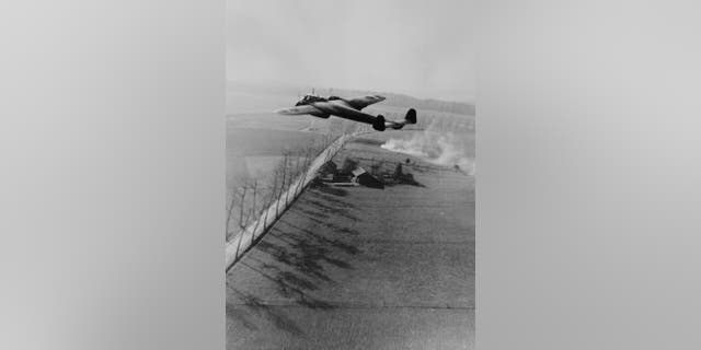 A Dornier 17Z of the Luftwaffe flying low over the English countryside.