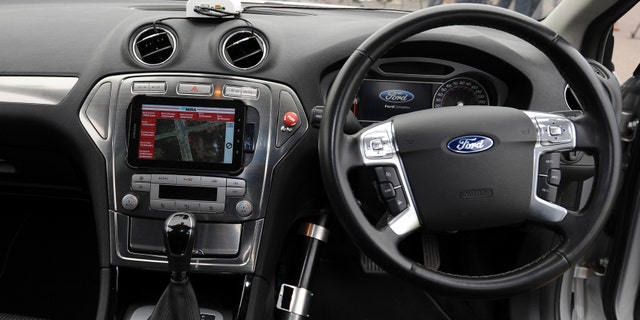 The interior of a driverless car during testing at the headquarters of motor industry research organization MIRA at Nuneaton in the West Midlands, England.