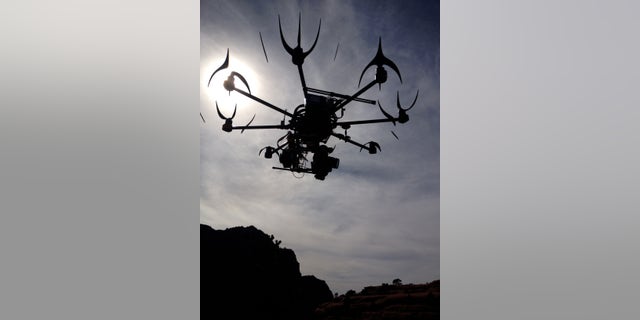 This image provided by Aerial MOB, LLC, shows their eight rotor Sky Jib Helicopter in San Diego, Calif., in August 2013.
