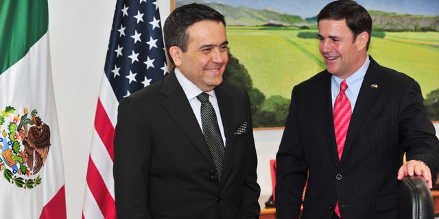 In this June 19, 2015 photo provided by the Office of Governor Doug Ducey, the Arizona governor, right, meets with Mexicoâs Secretary of the Economy, Ildefonso Guajardo Villarreal, also a graduate of Arizona State University, during Ducey's visit to Mexico City. It was Ducey's first trip to Mexico since his inauguration in January. (Victor Abreu/Office of Governor Doug Ducey, via AP)