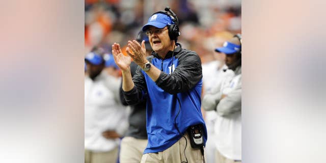 Duke’s head coach David Cutcliffe calls out to his player in the second quarter of an NCAA college football game against Syracuse in Syracuse, N.Y., Saturday, Nov. 8, 2014. Duke won 27-10. (AP Photo/Nick Lisi)