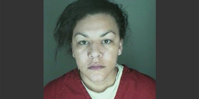 This undated booking photo provided by the Longmont Police Department shows Dynel Lane, 34, who is accused of stabbing a pregnant woman in the stomach and removing her baby, while the expectant mother visited her home to buy baby clothes advertised on Craigslist authorities said.
