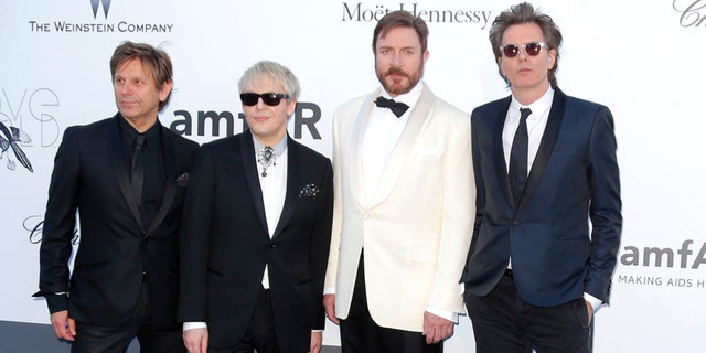 FILE - This May 23, 2013 file photo shows members of Duran Duran, from left, Roger Taylor, Nick Rhodes, Simon Le Bon and John Taylor arrive at amfAR Cinema Against AIDS benefit during the 66th international film festival, in Cap d'Antibes, southern France. The group known for hits like "Notorious" and "Hungry Like the Wolf" accuses the suburban Chicago-based club of breaching contract by not forwarding promised revenue to the band. The Chicago Sun-Times reports that Duran Duran's lawsuit names Glenview-based Worldwide Fan Clubs, Inc. as the defendant. The suit was filed in Cook County Circuit Court this week. (Photo by Todd Williamson/Invision/AP, File)