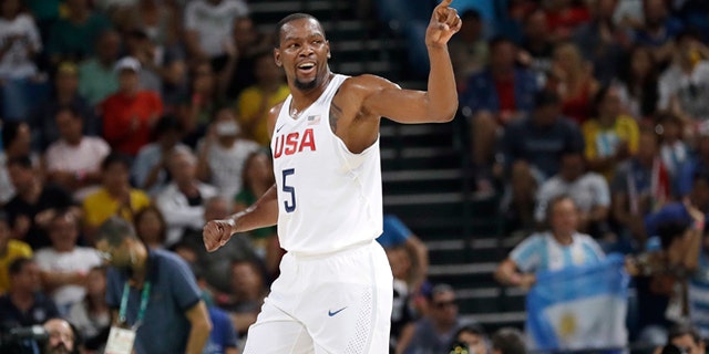 United States' Kevin Durant (5) signals to teammates after he scored against Argentina during a men's quarterfinal round basketball game at the 2016 Summer Olympics in Rio de Janeiro, Brazil, Wednesday, Aug. 17, 2016. (AP Photo/Eric Gay)