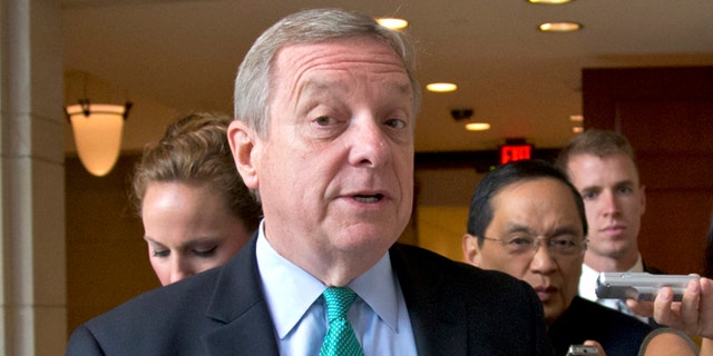 FILE: Sept. 4, 2013: Sen. Dick Durbin, D-Ill., walks at the Capitol in Washington, D.C.