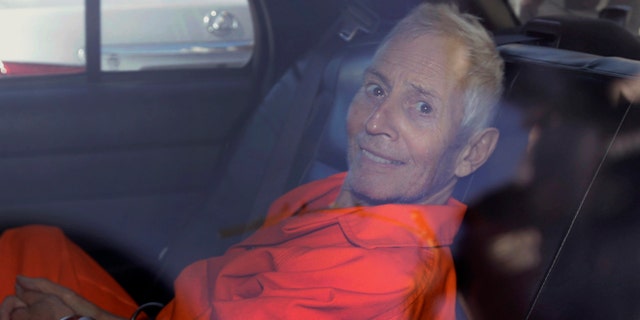 FILE - In this Tuesday, March 17, 2015, file photo, Robert Durst is transported from Orleans Parish Criminal District Court to the Orleans Parish Prison after his arraignment in New Orleans. The whispered words of Durst recorded in an unguarded moment in a bathroom could come back to haunt him - or help him - as he faces a murder charge. A possible move by prosecutors to introduce the incriminating material from a six-part documentary on his strange life and connection to three killings could back fire as interview footage did in the Michael Jackson molestation trial and the Robert Blake murder case. (AP Photo/Gerald Herbert, File)