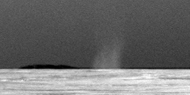 This photo taken July 15, 2010 shows the first dust devil observed by NASA's Mars Exploration Rover Opportunity in the rover's six-and-a-half years on Mars.