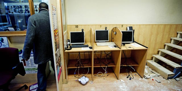 Dec. 25, 2010: The owner of the Banadir telecom center in Rotterdam, stands in his shop after Dutch authorities searched the place as they investigate following the arrests of twelve Somalis suspected of involvement in terrorist activities.