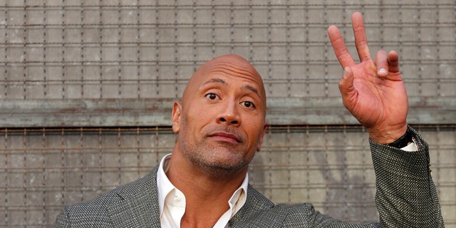 Cast member Dwayne Johnson poses at the premiere for the movie 