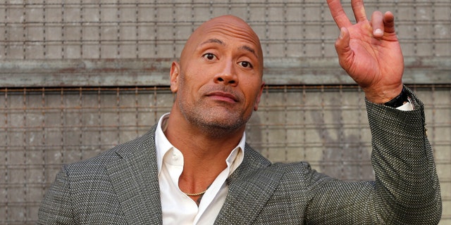 Cast member Dwayne Johnson poses at the premiere for the movie "Rampage" in Los Angeles, California, U.S., April 4, 2018. REUTERS/Mario Anzuoni - RC1788142AA0
