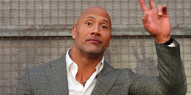 Cast member Dwayne Johnson poses at the premiere for the movie "Rampage" in Los Angeles, California, U.S., April 4, 2018. REUTERS/Mario Anzuoni - RC1788142AA0