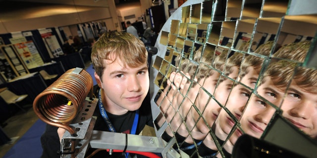 May 16, 2011: Seth Fisher, 16, from Bernville, Pa., demonstrates his solar heat concentrator at the Intel International Science and Engineering Fair, the world’s largest pre-college science competition, in Reno, Nev.