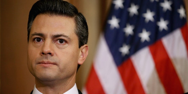 WASHINGTON, DC - NOVEMBER 27: Mexican President-Elect Enrique Pena Nieto delivers brief remarks after meeting with Democratic members of the House in the Rayburn Room at the U.S. Capitol November 27, 2012 in Washington, DC. Nieto, of Mexico's Institutional Revolutionary Party, will also visit the White House and meet with President Barack Obama today, days before he takes office on December 1. (Photo by Chip Somodevilla/Getty Images)
