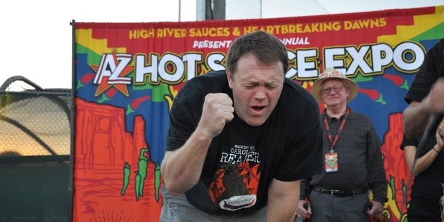 Greg Foster of Irvin, Calif. feels the burn after consuming 120 grams of Carolina Reaper peppers.
