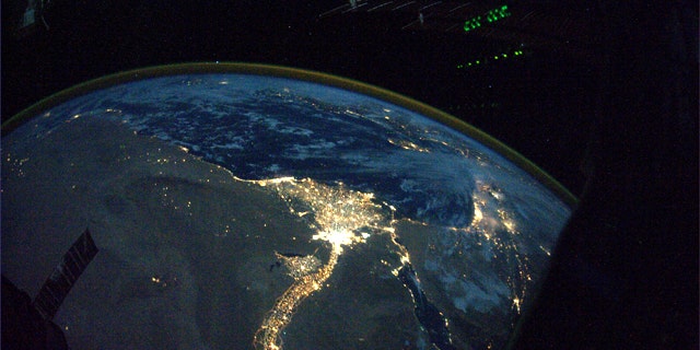 This image provided by NASA and posted to Twitpic by astronaut Douglas Wheelock on Oct. 31, 2010 shows a night view of the Nile River winding up through the Egyptian desert toward the Mediterranean as seen from the International Space Station.