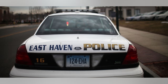 EAST HAVEN, CT - FEBRUARY 01: An East Haven Police car is viewed on February 1, 2012 in East Haven, Connecticut. Following an investigation by the FBI, four East Haven police officers were arrested last week and accused of abusing Latinos in the working class community of 28,000 people which was nearly predominately white a generation ago. A recent civil rights investigation which was released last month revealed a pattern of discriminatory policing East Haven and the town has been warned by the U.S. Justice Department to make reforms. The arrested officers have been accused of subjecting Hispanics to beatings and false arrests among other things. Currently East Haven's Latino population is around 10 percent. (Photo by Spencer Platt/Getty Images)