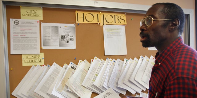 February 2011: Job seeker Richard Phillips looks for a job opportunity at the Verdugo Job Center in Glendale, California.
