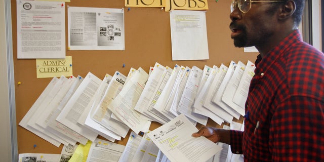 February 2011: Job seeker Richard Phillips looks for a job opportunity at the Verdugo Job Center in Glendale, California.