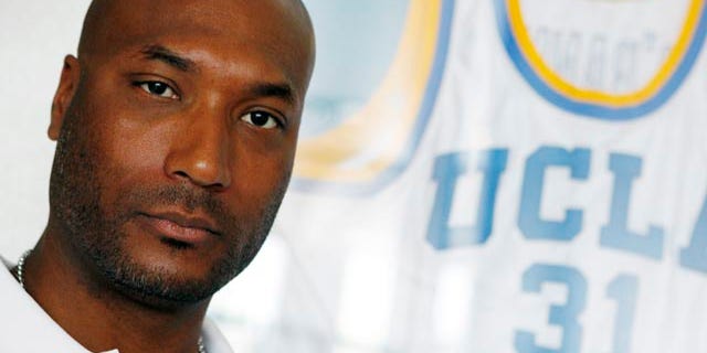 FILE - In this Sept. 18, 2010, file photo, former UCLA basketball player Ed O'Bannon Jr. sits in his office in Henderson, Nev. A $40 million settlement has been completed that will pay college football and basketball players dating to 2003 for the use of their likenesses in NCAA-branded videogames. (AP Photo/Isaac Brekken, File)