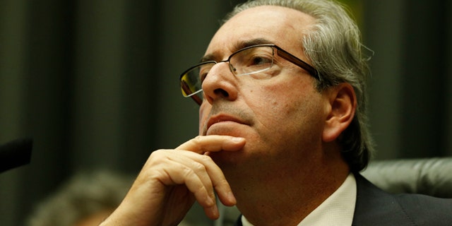 BRASILIA, BRAZIL - MARCH 17: Eduardo Cunha, Speaker of the house, addresses the plenary during a special session of legislators negotiating the nomination of memberson of the committee that will initiate the impeachment process of President DIlma Rousseff on March 17, 2016 in Brasilia, Brazil. His controversial cabinet appointment comes in the wake of a massive corruption scandal and economic recession in Brazil. (Photo by Igo Estrela/Getty Images)