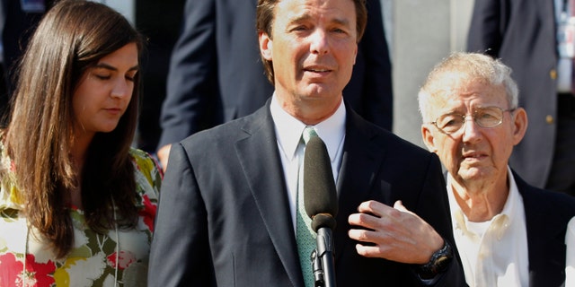 May 31, 2012: Former presidential candidate John Edwards speaks outside a federal courthouse as his daughter, Cate Edwards, left, and father Wallace Edwards, listen after his campaign finance fraud case ended in a mistrial, in Greensboro, N.C.