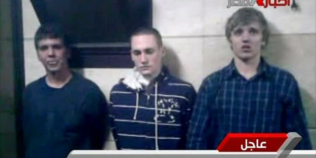 Nov 22 2011: Three American students are displayed to the camera by Egyptian authorities following their arrest during protests in Cairo, where an Egyptian official said they were throwing firebombs at security forces.