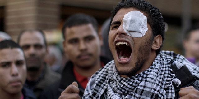 Jan. 31: An Egyptian protestor shouts slogans during a rally outside the Parliament in Cairo.