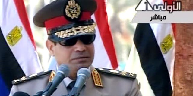July 24, 2013: In this image taken from Egypt State TV, Egyptian Defense Minister Gen. Abdel-Fattah el-Sissi delivers a speech in Cairo, Egypt.