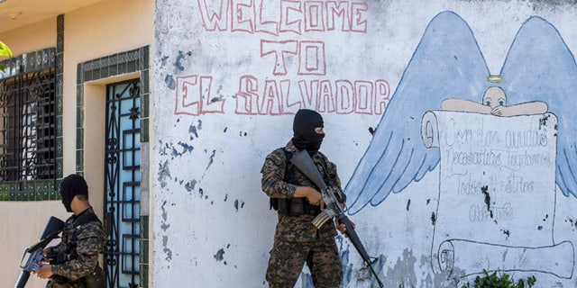 FILE - In this Aug. 31, 2015 file photo, soldiers guard a corner in a gang-controlled neighborhood in Ilopango, El Salvador. A video broadcast by local media on Saturday, March 26, 2016, purportedly made by the countryâs main street gangs, is offering an end to killings, and asks the government not to continue an anti-gang offensive. Officials said they would not negotiate with the gangs. (AP Photo/Salvador Melendez, File)